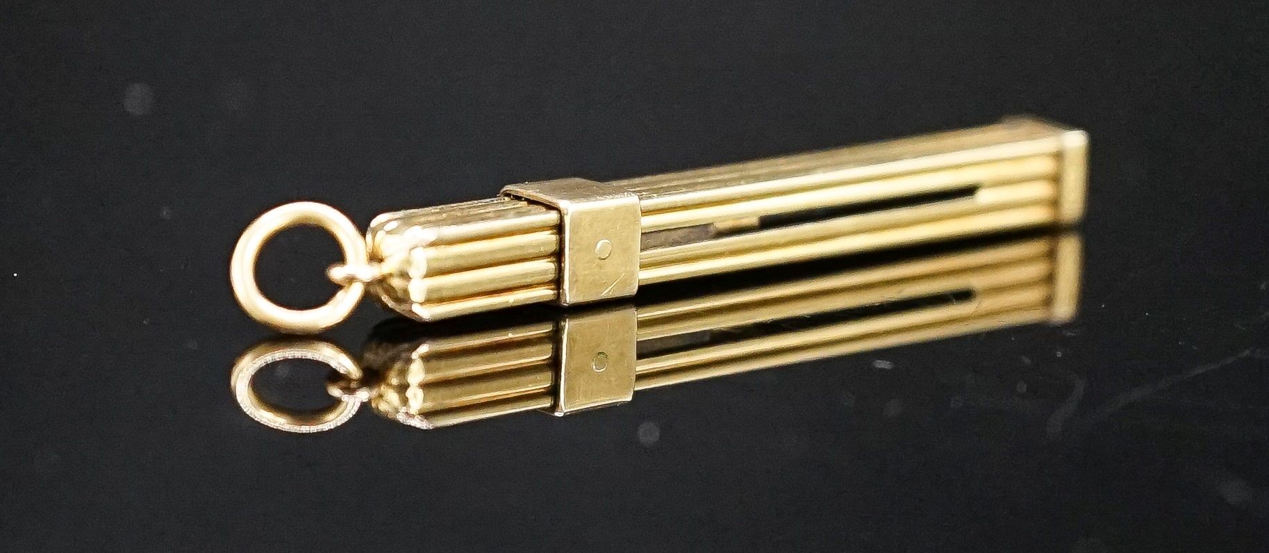 A yellow metal mounted tortoiseshell propelling toothpick, 52mm.